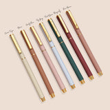 Classic Ballpoint Pen in various sleek colors with gold accents, perfect for elegant writing.