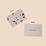 Floral card on beige background with 'Happy Birthday' text