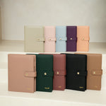Eight A5 ring binder refillable planner covers made of vegan leather. Colour  covers in light beige, pink, light blue, purple, and peach, dusty pink, forest green, burgundy, black, and tan.