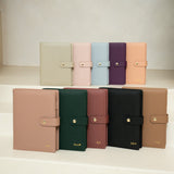Eight A5 ring binder refillable planner covers made of vegan leather. Colour  covers in light beige, pink, light blue, purple, and peach, dusty pink, forest green, burgundy, black, and tan.