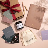 Personalised Stationery Gift set with a notebook, candle, affirmation cards, and a pen