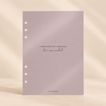 A single sheet of pale lavender paper with three punched holes on the left side and centered text reading, 'A FRESH START (ISN'T A NEW PLACE / it's a new mindset)' with 'FATE CO PAPER' at the bottom planner dashboard